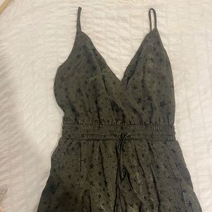green and black star flowy romper